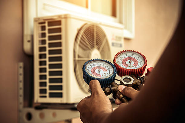 Professional Air Conditioning Service technician working in East Syracuse, NY